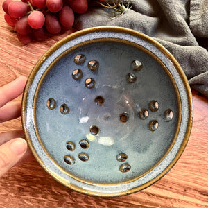  Pint size berry colander. Wheel thrown pottery, red stoneware shown in Icy Blueglaze.