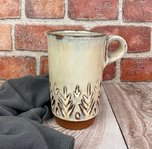 Load image into Gallery viewer, Travel mug in red stoneware clay, hand carved tree pattern, glazed in speckled white glaze. (no lid)