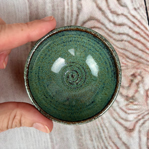 Tiny bowl, sauce bowl, ring dish. Wheel thrown on the potters wheel in a red stoneware clay  and glazed in Moss Green glaze, which shows depth and a variety of color.