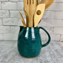 Load image into Gallery viewer, Teal pottery pitcher on red stoneware clay, shown here being used as a utensil holder