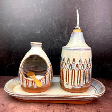 Load image into Gallery viewer, Salt cellar and Oil Cruet set with matching tray shown together here.  Made in  a red stoneware clay, carved and glazed in a speckled white glaze. Fern Street Pottery