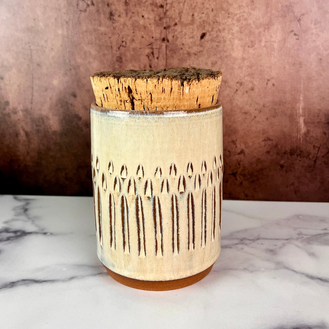 Canister (Medium size) for beautiful display and storage. this canister is made from red stoneware clay, carved with a pattern and glazed in a speckled white glaze. the canister has a natural, rough cork lid. 