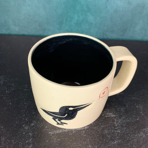 handcrafted, wheel thrown crow love mug with solid black interior