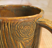 Load image into Gallery viewer, close up detail of woodgrain carving on pottery mug. Fern Street Pottery.