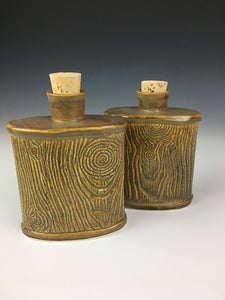 two pottery lumberjack flasks with cork stoppers