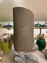 Load image into Gallery viewer, woodgrain textured vase, cylindrical in shape with heart and initials carved into texture. reminiscent of a tree with carved initials