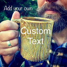 Load image into Gallery viewer, woodgrain textured pottery mug with customizable text added. appears as initials carved into a tree trunk, or name in a heart carved into a tree