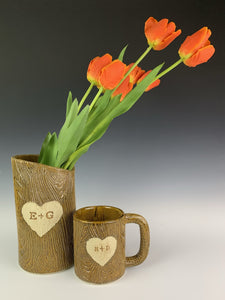 lumberjack vase and mug. pottery mug with woodgrain texture, heart and initials carved into surface