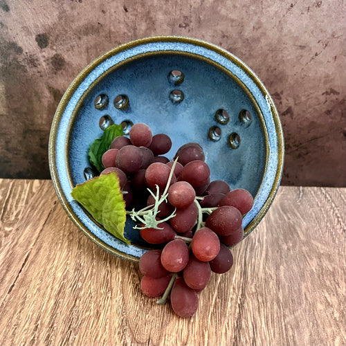  Pint size berry colander. Wheel thrown pottery, red stoneware shown in Icy Blue glaze.