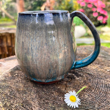 Load image into Gallery viewer, OOAK=One of a kind mug in shades of mottled grey with spots of bright turquoise showing through at the bottom edge. This mug is full of subtle color variation throughout.