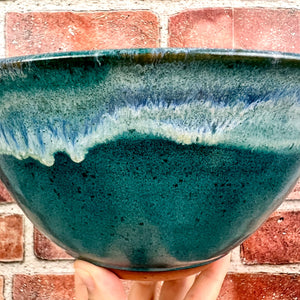 detail image of glaze on a Serving bowl glazed in Teal with a beautiful icing glazed rim.