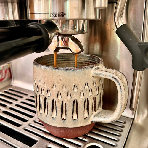 the carved mug shown under the Breville Espresso maker. Perfect fit, perfect cup of coffee.