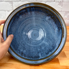 Load image into Gallery viewer, Large, wheel thrown serving bowl. Thrown in a deep red stoneware and glazed in an Icy Blue glaze