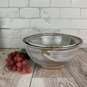 Artisan crafted serving bowls in a rustic Speckled White glaze. bowls are  8" and 9" in diameter