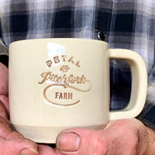 Load image into Gallery viewer, a customized logo on a mug. logo is stamped in and colored with brown on a white mug.
