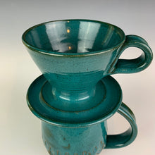 Load image into Gallery viewer, Coffee pour over with finger loop handle, shown on top of a matching mug.  wheel-thrown pottery, Teal glaze on red clay