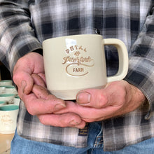 Load image into Gallery viewer, a customized logo stamped into a mug, and inset with brown on white clay.