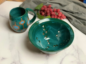 8" colander in teal, shown with matching teal MidMod Mug.