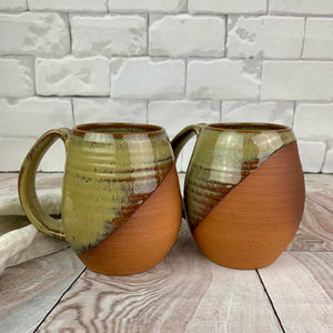 Caramel glazed, angle dipped mugs, showing the beautiful red brown stoneware beneath. wheel thrown pottery