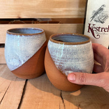 Load image into Gallery viewer, two pottery tumblers in &quot;speckled white&quot; glaze. tumblers have finger divots and are dishwasher safe.