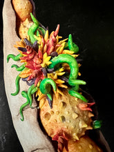 Load image into Gallery viewer, detail image of my Seed Pod Sculpture, &quot;Sprouting Pod&quot;. Sculpted from stoneware it shows the dry outer husk in contrast with the vibrant blooming seeds which are growing and sprouting from within.
