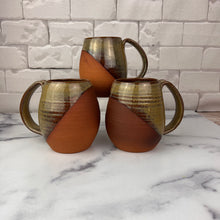 Load image into Gallery viewer, a grouping of Large Pottery Mugs glazed in a geometric, angled design, in a caramel colored glaze. wheel thrown with pulled handle. each one is unique but they are well matched. Fern Street Pottery. Angle dipped mug.