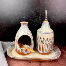 Load image into Gallery viewer, Salt cellar and Oil Cruet set with matching tray shown together here.  Made in  a red stoneware clay, carved and glazed in a speckled white glaze.