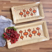 Load image into Gallery viewer, newly made, vintage style. Two MidMod serving trays, designed to fit in with your MidCenturyModern style. shown here in Dijon Yellow with orange accent, and some beautiful red stoneware clay showing through.