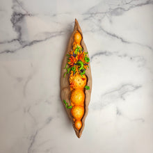 Load image into Gallery viewer, Seed Pod Sculpture, &quot;Sprouting Pod&quot;. Sculpted from stoneware it shows the dry outer husk in contrast with the vibrant blooming seeds which are growing and sprouting from within.
