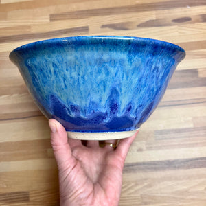 large "Blue World" serving bowl. wheelthrown, trimmed and glazed by Artist, Meredith Chernick. the bowl is glazed in cobalt blue with turquoise green glaze melting down into the blue from the rim of the bowl. No two are ever the same, each with unique drip patterns