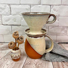 Load image into Gallery viewer, Coffee pour over and matching angle dipped mug and bud vase. shown in speckled white over rich red stoneware. Fern Street Pottery
