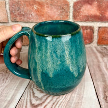 Load image into Gallery viewer, green glaze with a dripping &quot;icing&quot; glaze over a red stoneware clay. each one is thrown on the wheel and glazed by hand, each one is unique but well matched. northwest style coffee mug thrown pottery, with large pulled handle.
