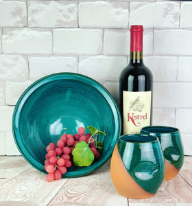 Teal serving bowl shown with matching wine tumblers. Large, wheel thrown serving bowl. Thrown in a deep red stoneware and glazed in rich teal