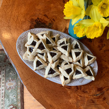 Load image into Gallery viewer, Oval serving platter (16.5&quot; x 9.5&quot;) in carved speckled white with Hamentashen cookies 
