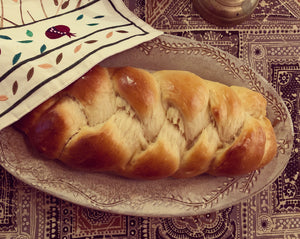Oval serving platter (16.5" x 9.5") in carved speckled white as a Challah platter