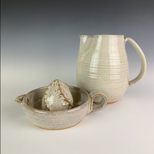 Pottery Citrus juicer, thrown on the wheel in red clay, glazed in speckle white. shown with matching pitcher.