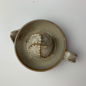 Pottery Citrus juicer, thrown on the wheel in red clay, glazed in speckled white. shown from above to show texture on dome