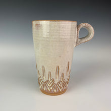 Load image into Gallery viewer, Tree carved travel mug. red stoneware, white glaze, hand carved tree pattern. no lid