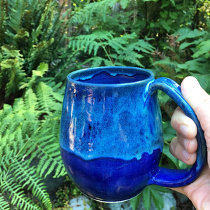 northwest mug in "blue world" glaze, shown in the PNW outdoors