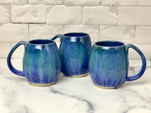 Blue World mugs, blue glaze with melty turquoise blue and green glaze. each one is different. northwest style coffee mug thrown pottery, with large pulled handle.