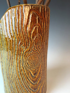 detail of pottery faux wood vase