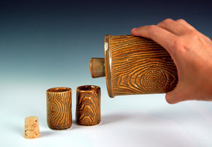lumberjack flask, pouring into shot glasses. woodgrain looking pottery