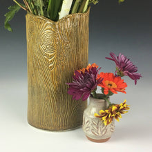 Load image into Gallery viewer, carved bud vase shown with daisies. woodgrain vase shown in background.