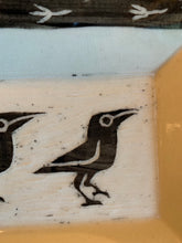 Load image into Gallery viewer, detail shot of crow carving in a pottery platter, texture is shown