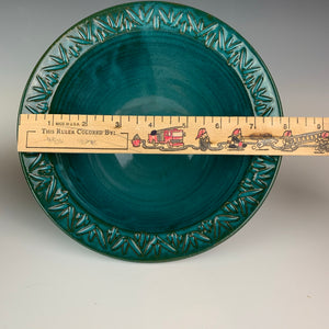 carved rim bowl in teal, showing the dimensions, marked by a ruler. This one is just under 8" diameter at the outside edge