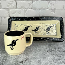 Load image into Gallery viewer, crow mug shown with a three crow sgraffito carved platter. hand made and hand carved by meredith at fernstreet pottery