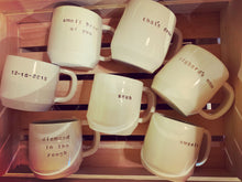 Load image into Gallery viewer, a collection of pottery mugs with customized text 