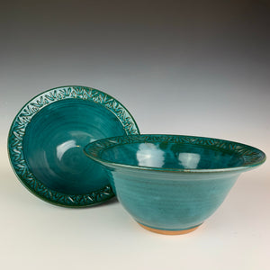 two carved rim serving bowls in teal.