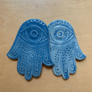 ceramic hamsa wall hanging, hand carved, two here, shown in Sky blue