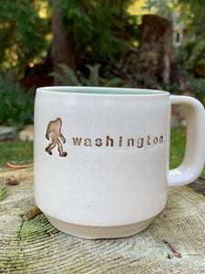 custom made pottery mug with text "washington" and a sasquatch